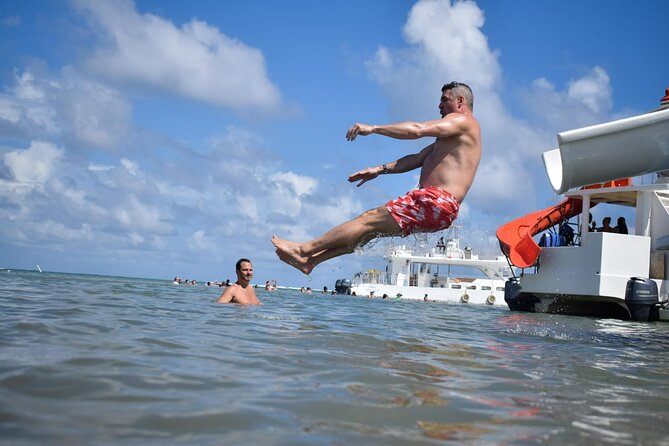 Experience for families and friends by private boat with pick-up - Slides, snorkeling gear, and the rhythm of a 3-hour day