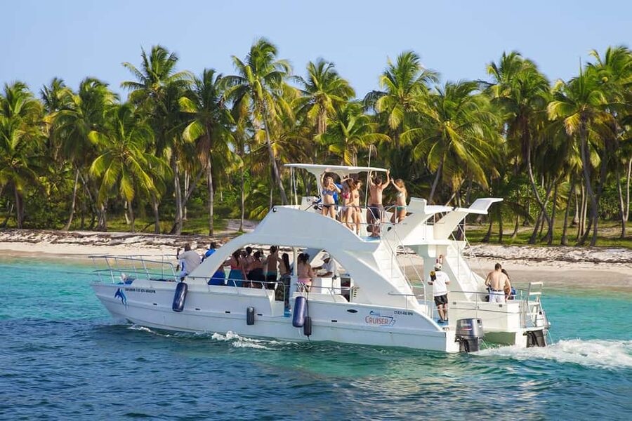 From Bavaro, Punta Cana: Boat Party, Snorkeling, Drinks, Snacks, and Transportation - Dolphin spotting, snorkeling, and a slide: the tour flow from Bávaro