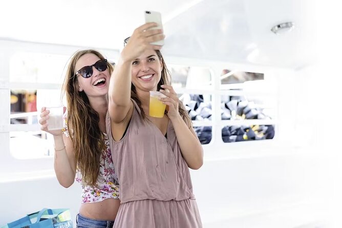 Happy Hour Party Boat With Snorkeling - Boarding the catamaran: crew energy and comfort rules