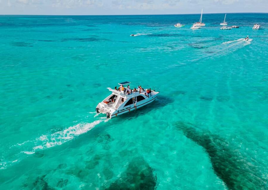 Punta Cana: Catamaran Tour with Reef Snorkeling and Open Bar - Extra fun details: slide time and photo options