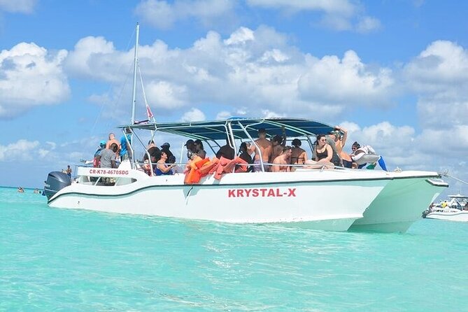 Saona Island from Punta Cana with Transportation and Lunch Included - Catamaran party ride back to Bayahibe: snacks, drinks, and dancing